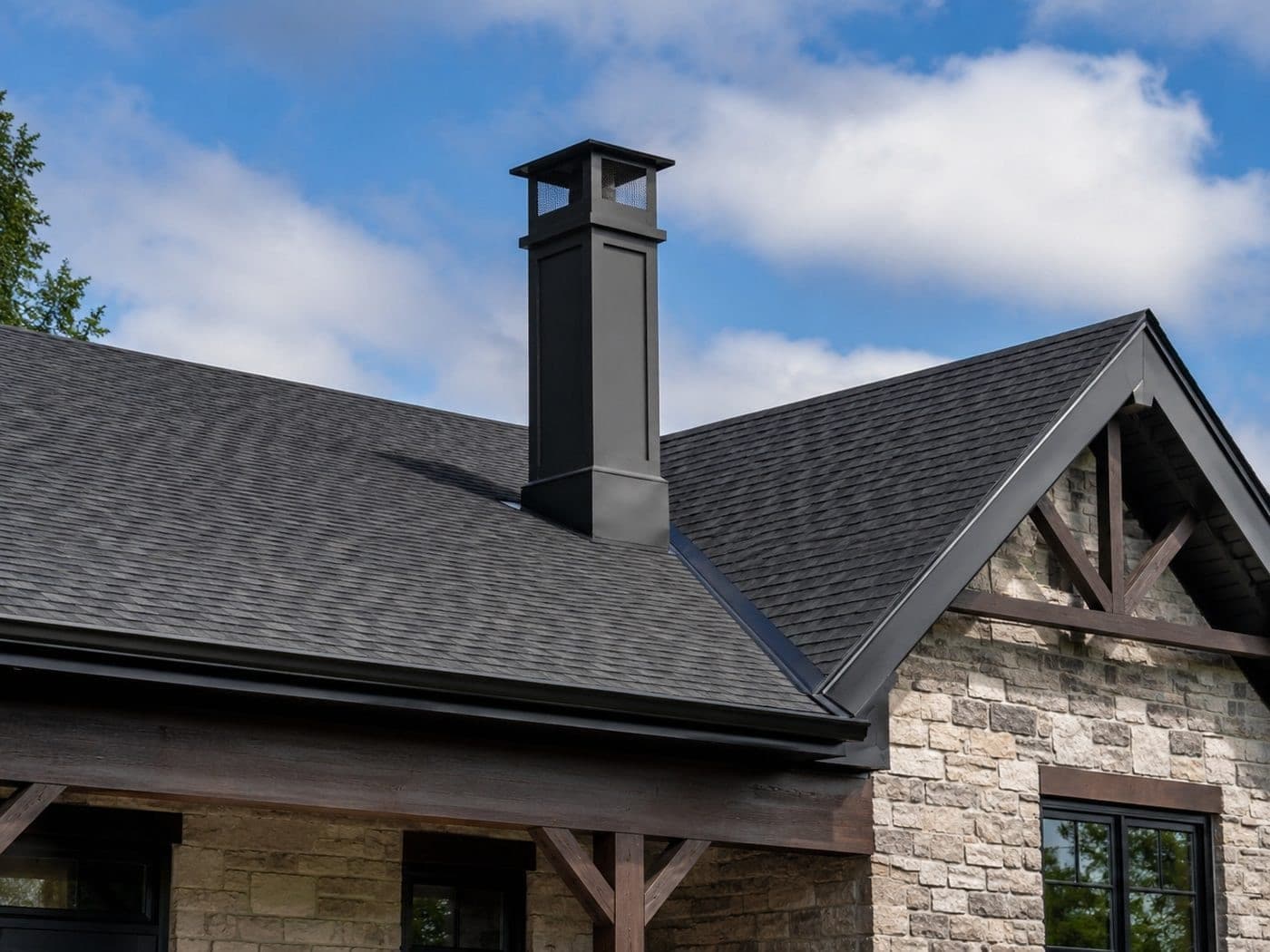 Metal prefab chimney chase with a decorative shroud